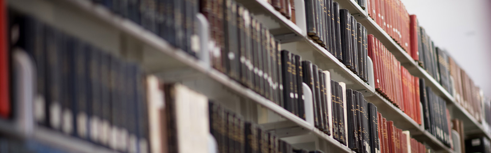photo of journal publications on bookshelf in library